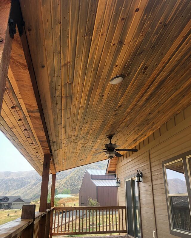 Stained wood porch ceiling and deck